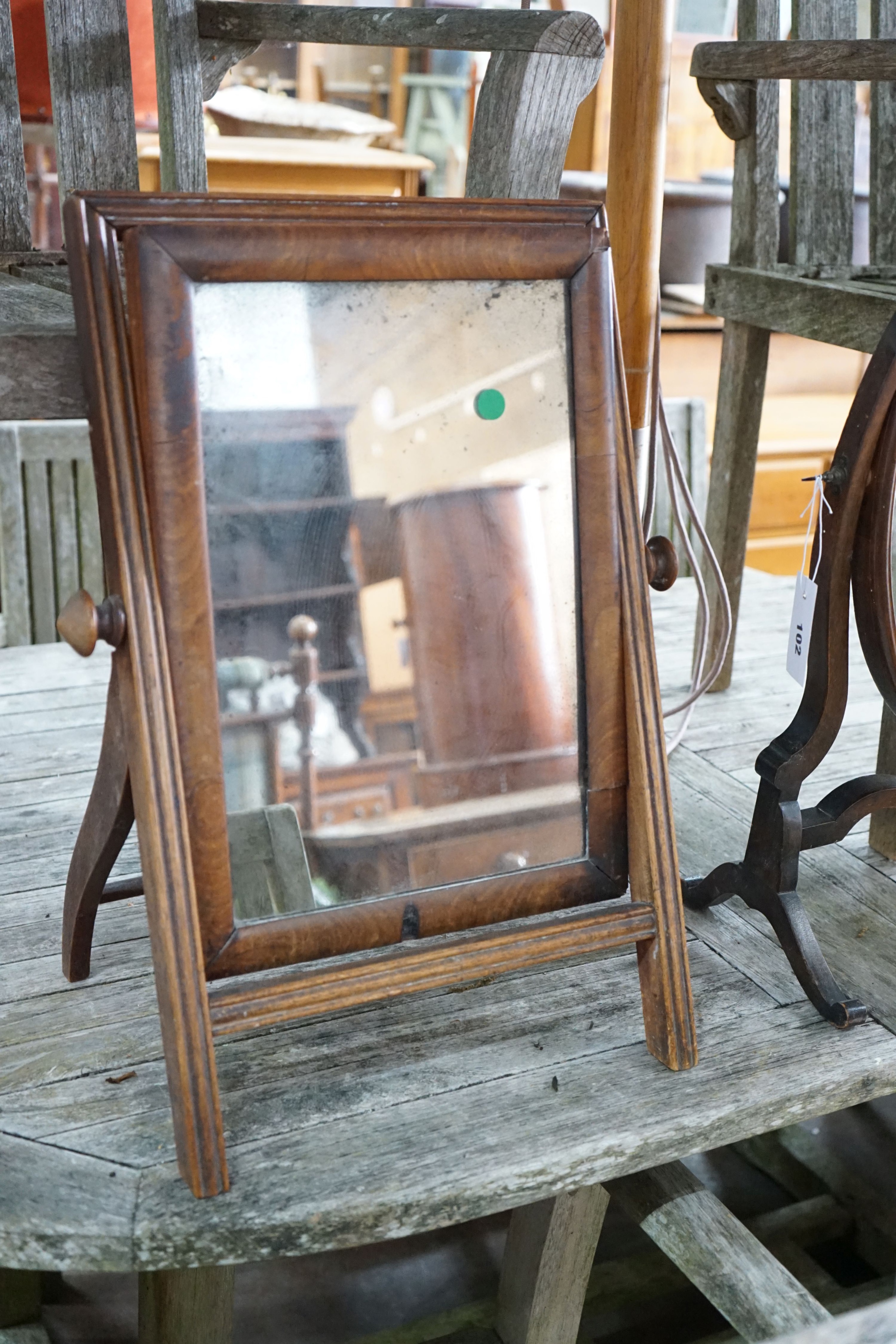 A Victorian mahogany toilet mirror, height 55cm together with a later skeleton framed toilet mirror
